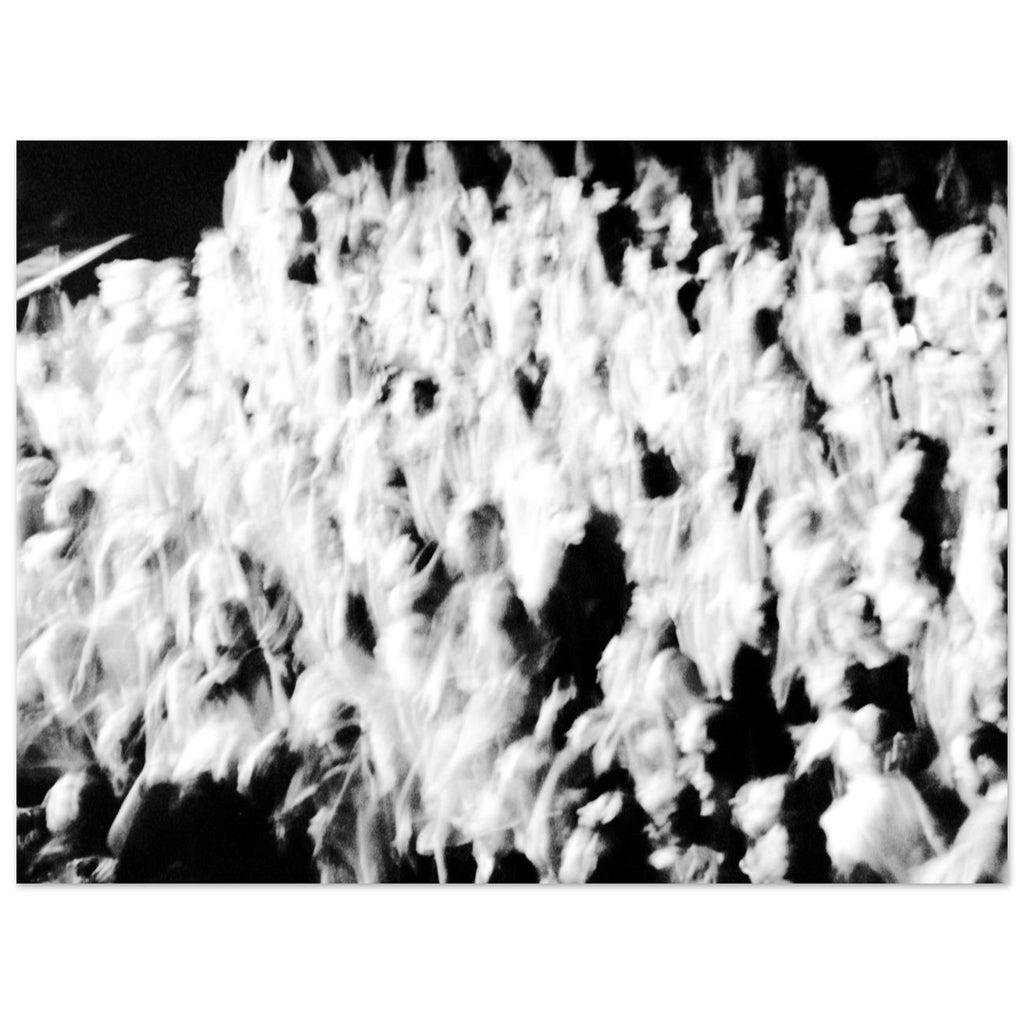 Abstract black and white film photograph of a moving crowd with motion blur