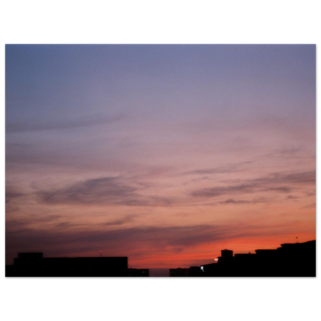 Sunset sky with silhouettes of buildings