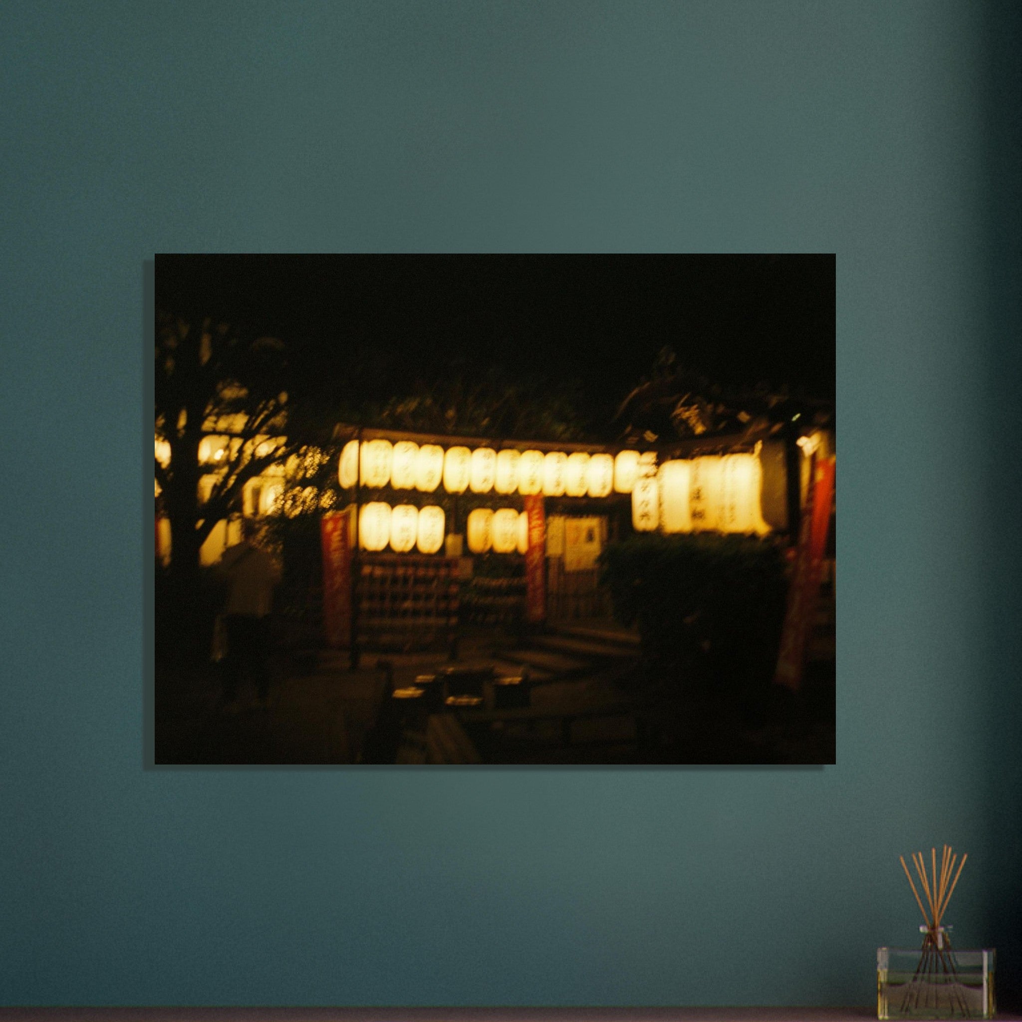 Warm nighttime film photo of a softly lit street scene in Japan