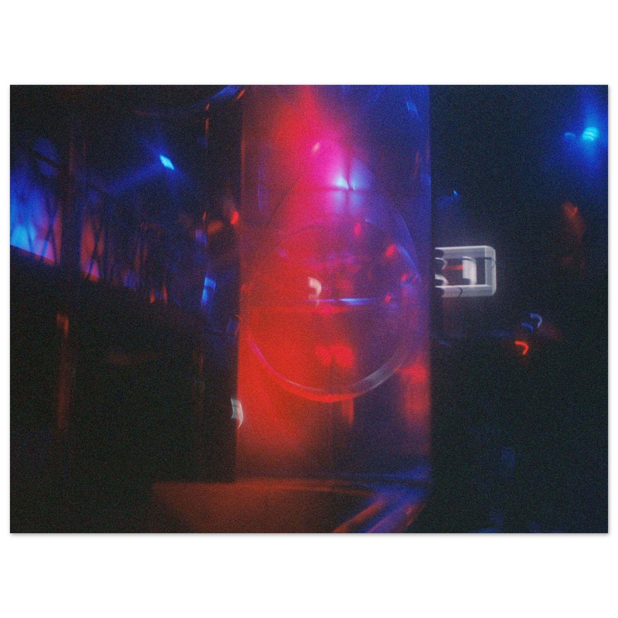 Neon sign with red and blue lights in a dark setting