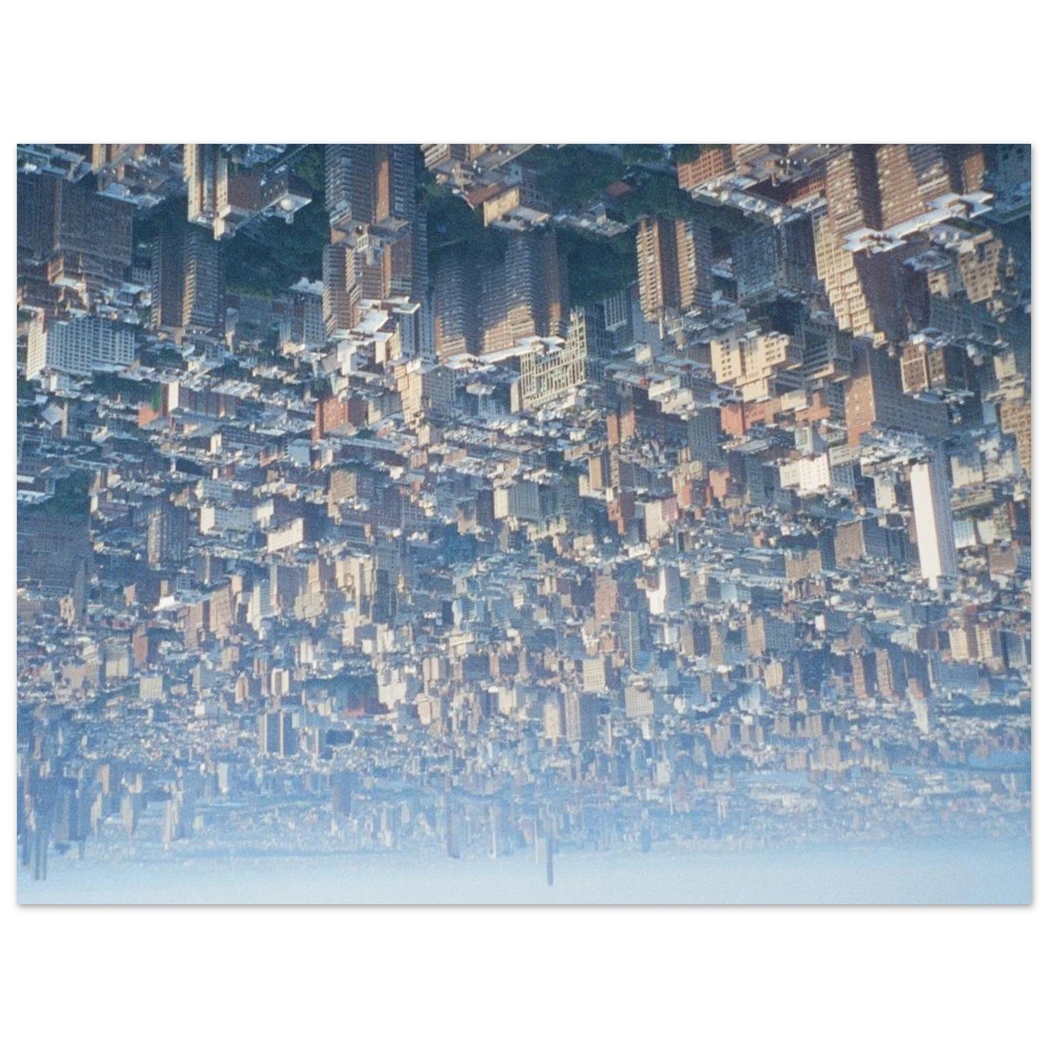 Upside-down film photograph of a dense New York City skyline.