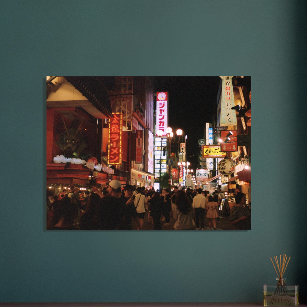 Film photograph of a busy Osaka night street filled with neon signs and crowds