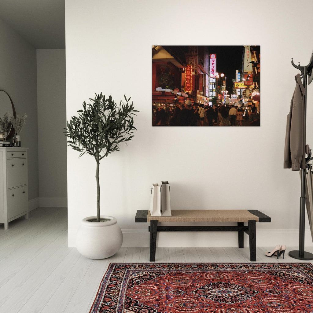 Film photograph of a busy Osaka night street filled with neon signs and crowds