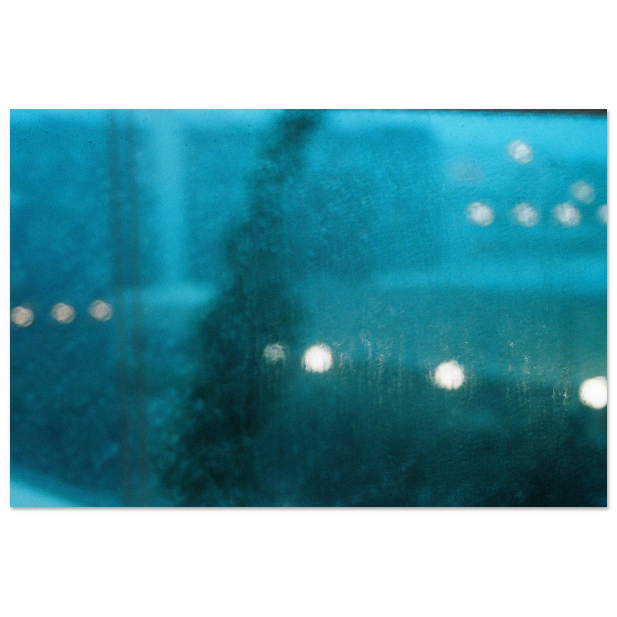 Close-up of a textured blue surface with light reflections