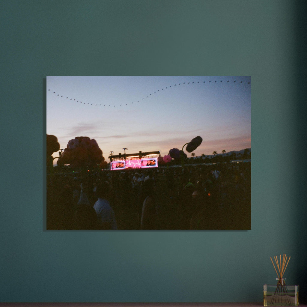 Framed photograph of a concert scene with a microphone on a teal wall.
