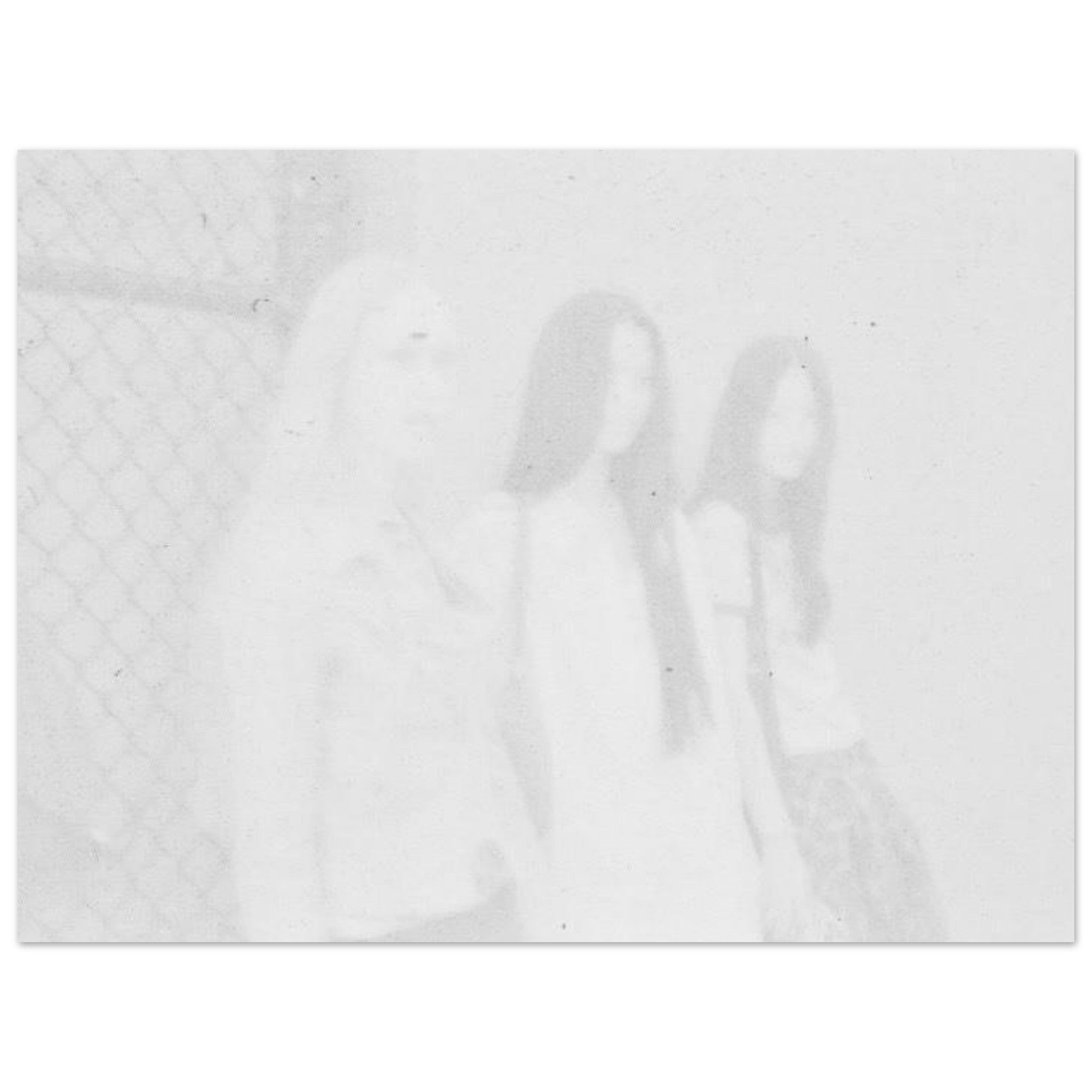 Faded high-key film image of three women standing against a fence