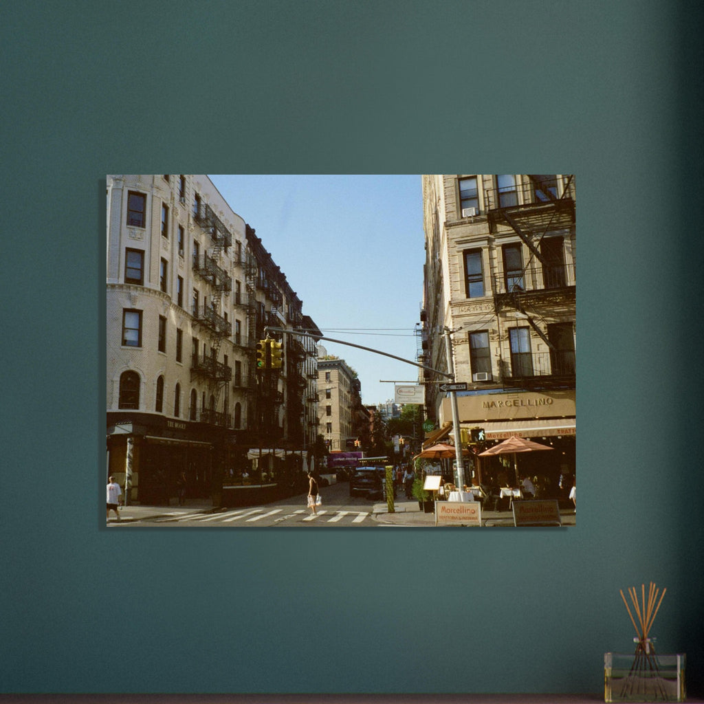 City street scene with buildings and traffic lights on a teal wall.