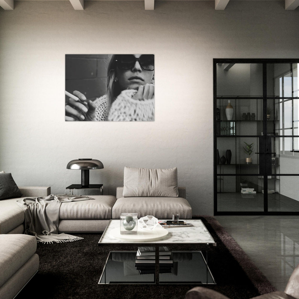 Modern living room with a gray sofa, coffee table, and wall art.